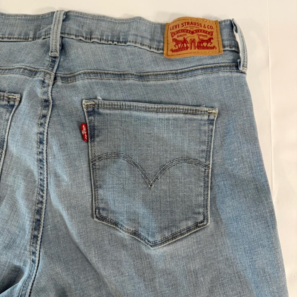 Levis Slimming Skinny Jeans Womens 30 Light Wash Distressed Ripped Denim Jeans